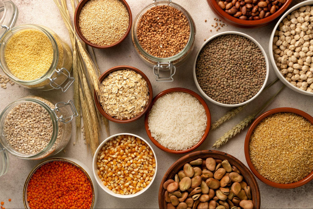 A collection of various grains and seeds displayed in bowls, showcasing their diverse colors and textures.