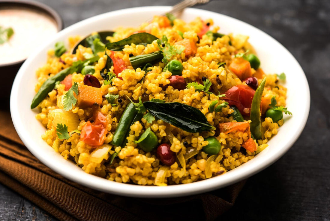 Indian rice pilaf featuring colorful vegetables and beans, served in a bowl, garnished with herbs.